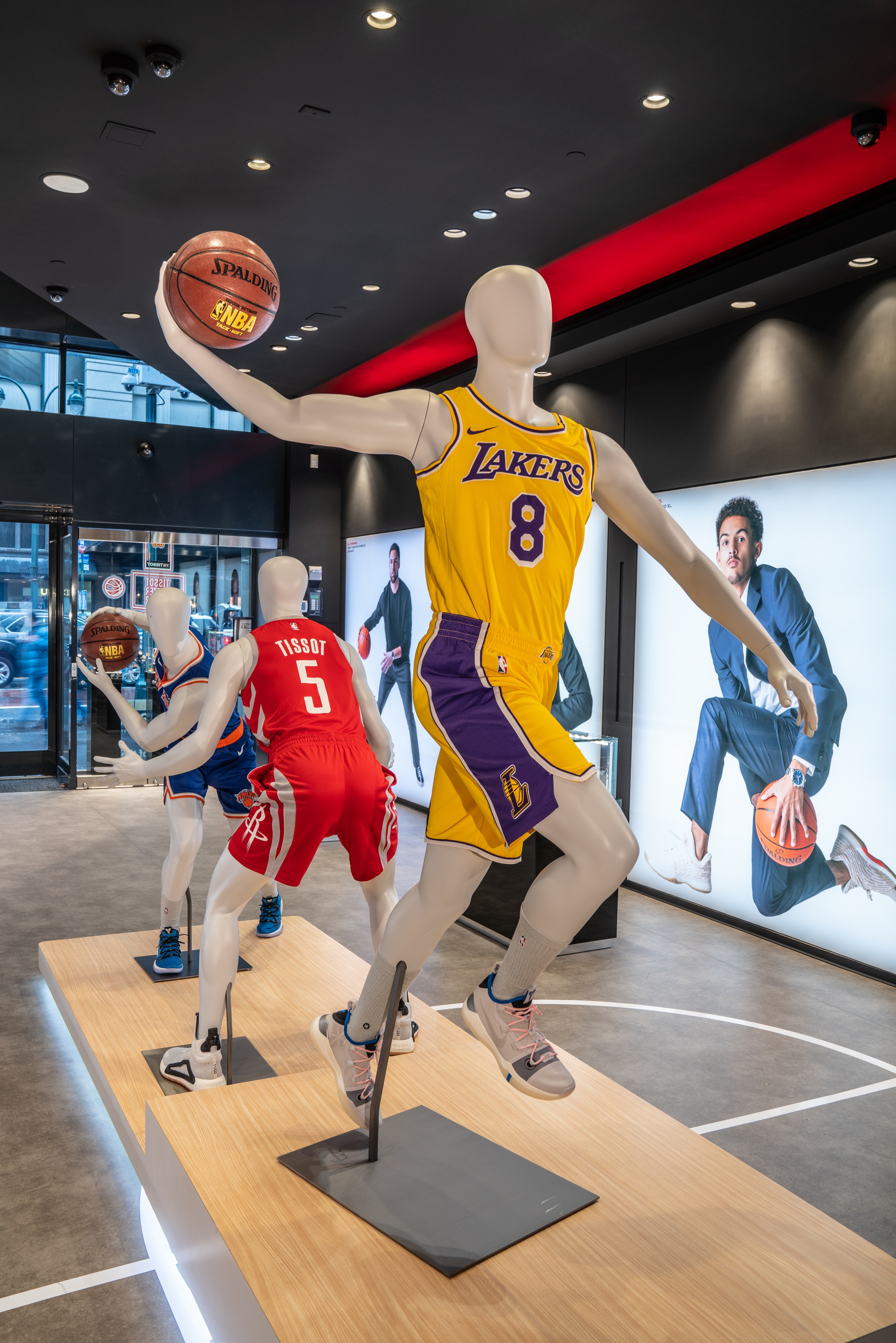 MANNEQUINS WITH COLORFUL CLOTHES INSIDE NBA STORE IN MANHATTAN NEW