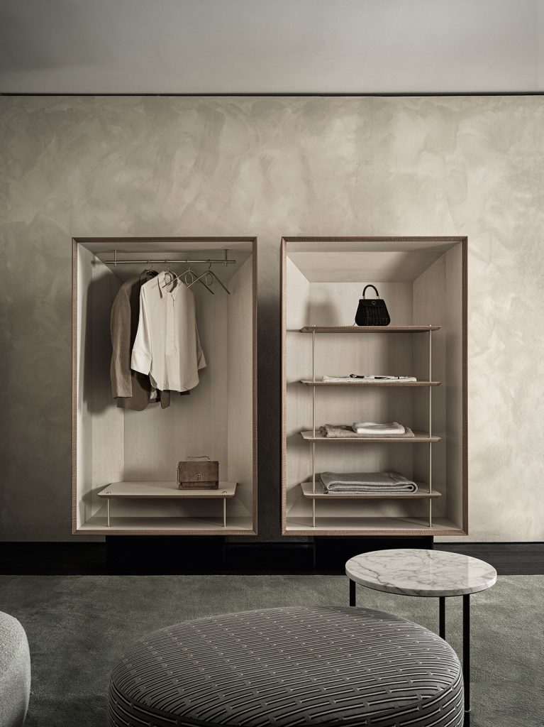 Duale Wardrobe: Duale is a stunning new storage system from luxury Italian brand, Gallotti & Radice. Featuring a beautiful fusion of frise walnut and white Tanganika wood, it is a visually soothing and minimal wardrobe. It's carefully designed rails and shelves ensure fuss-free storage and easy access to your favourite outfits. Meanwhile, the brass details complement the pared back woods, adding a luxe Italian touch. Pictured here with the Audrey Pouf and Cookies Circle Coffee Table - also available at Chaplins.