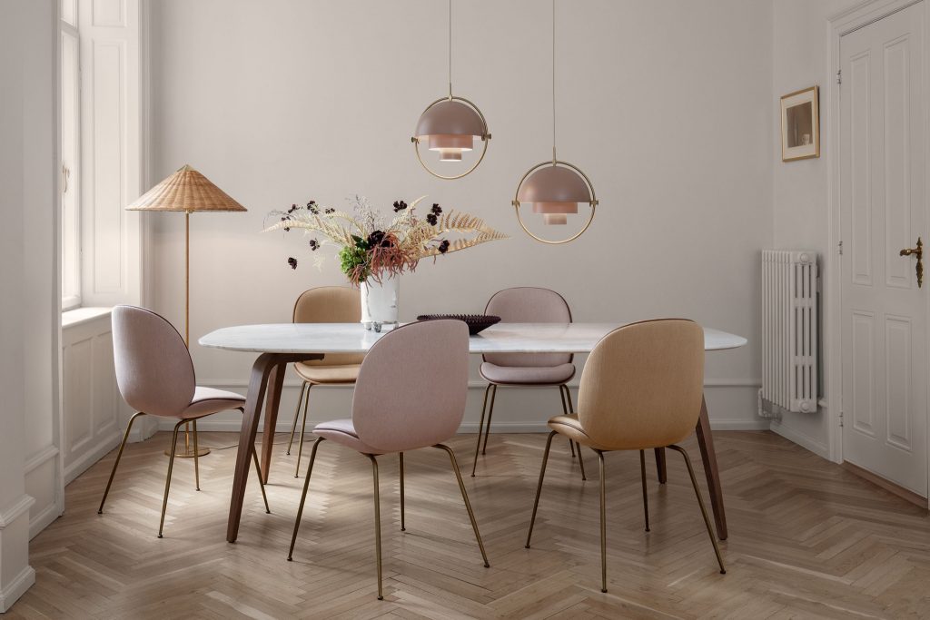 CHAPLINS 9602 Floor Lamp and Beetle Chairs By Gubi. This striking oriental-inspired lamp was originally designed in 1935 for the Hotel Aulanko in Finland. It bears all the hallmarks of Eastern aestheticism, transforming humble materials such as wicker and canvas into a timeless, ethereal luminaire.