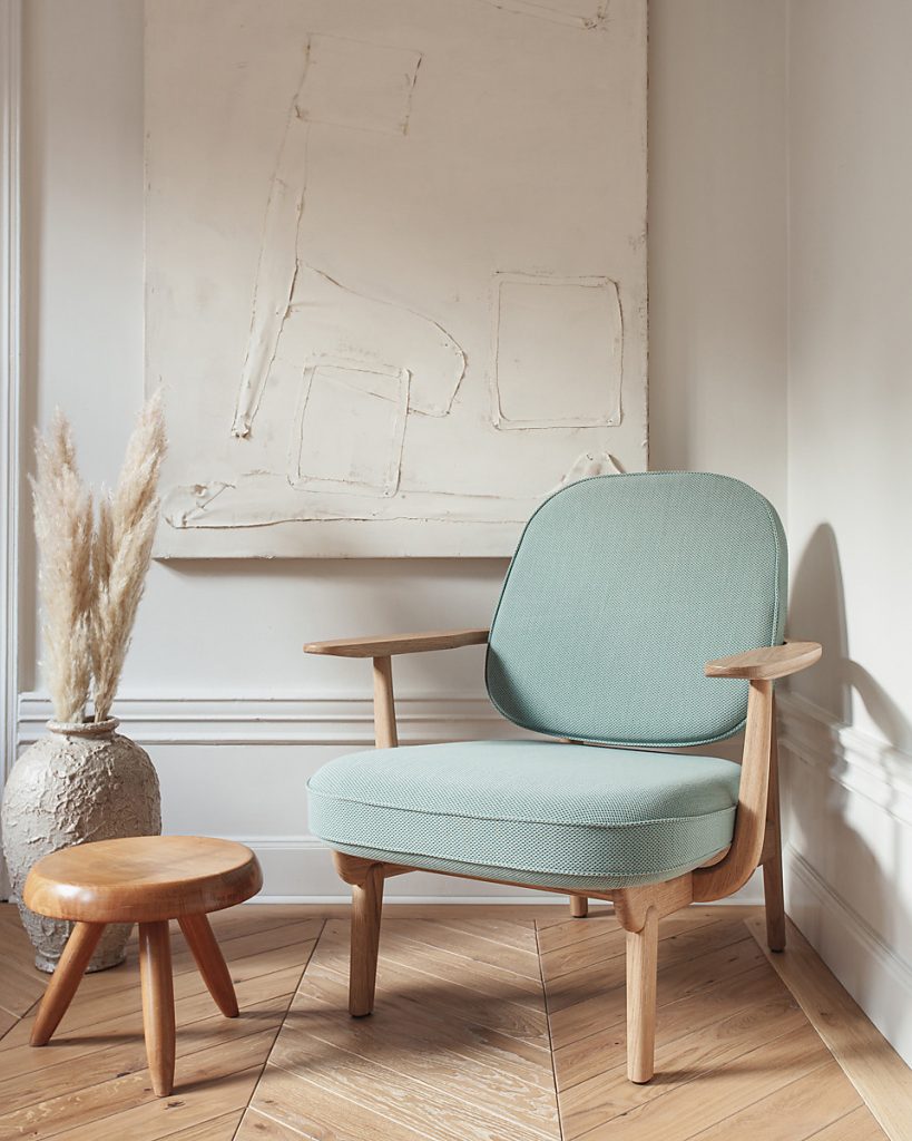 CHAPLINS JH97 Fred Armchair By Fritz Hansen. The JH97 Lounge Chair is a classic Danish design by Fritz Hansen. Its long, elegant frame is inspired by the graceful physiology of a pelican, which wraps around the generous seat and back cushions. The upholstery is available in plush velvet, leather or an on-trend Bouclé fabric. Available to purchase from September 2019, it's definitely one to watch this season.