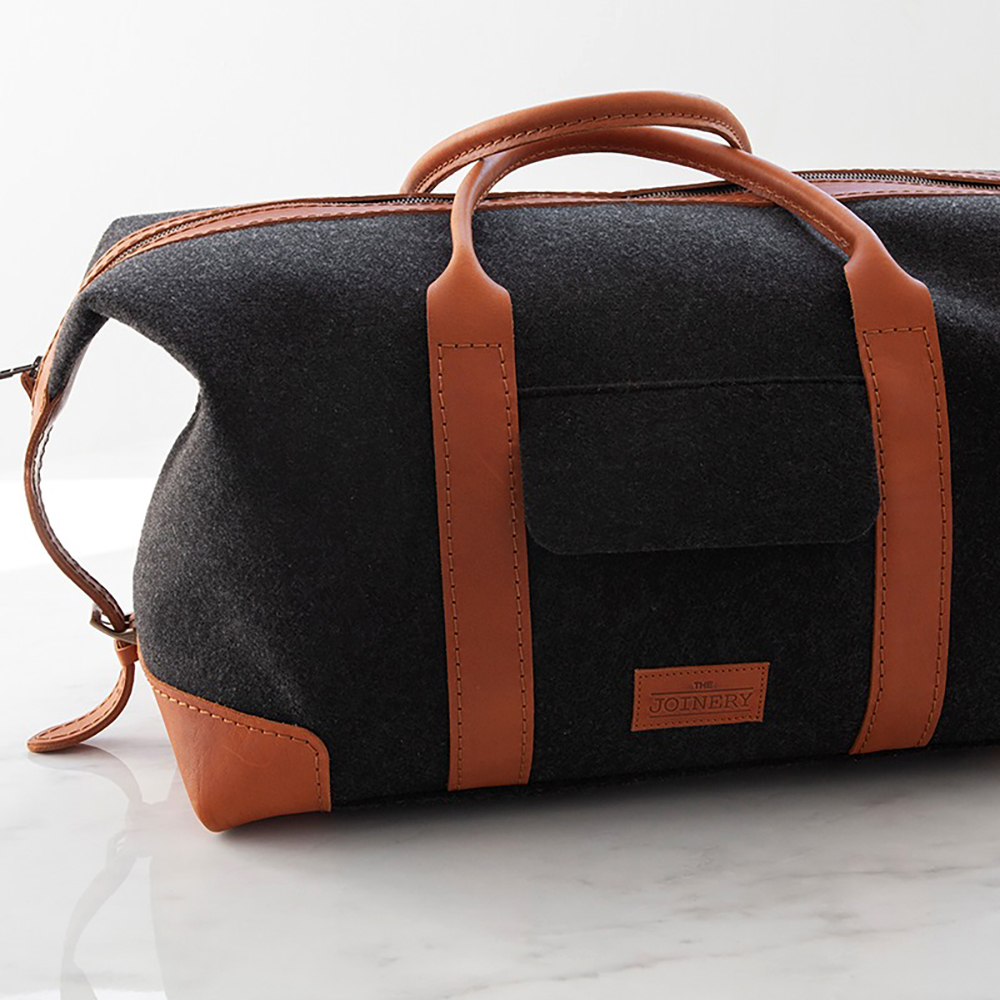 This sturdy, hand made Overnight Travel Bag is made from 24 recycled plastic bottles. The leather handles offer a luxurious finish. It is fully lined inside with a pocket. Perfect for travel and weekends away.