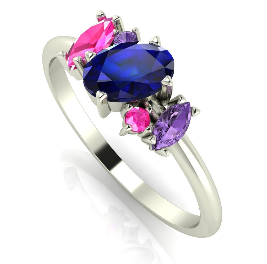 Atlantis - Sapphire Rainbow - Blue. Diverse, exciting and unusual this ring features an 18ct white gold band with stunning sapphires that twist around each other creating the illusion of movement. This ring would make a beautiful, quirky engagement ring or for any special occasion.