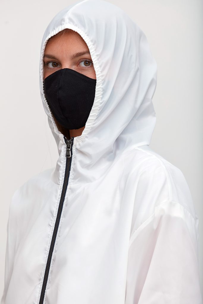 The Protective Jacket by Grey State Apparel features an innovative anti-microbial HeiQ V-block finishing, utilizing patented and registered Silver Technology for antimicrobial and antibacterial protection. Lightweight and durable, this jacket keeps clothes covered and germs out with elasticated cuffs, hem, and hood. 