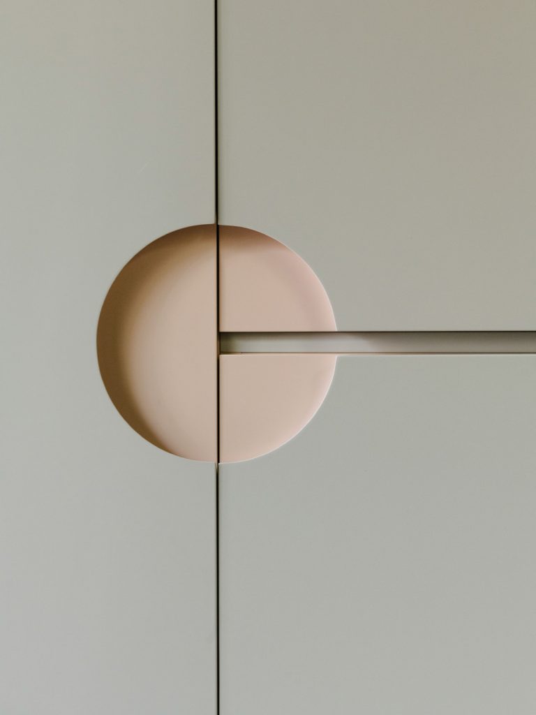 A detail of the bathroom cabinet door handle. Photo ©Robert Rieger, Courtesy of Ester Bruzkus Architekten.