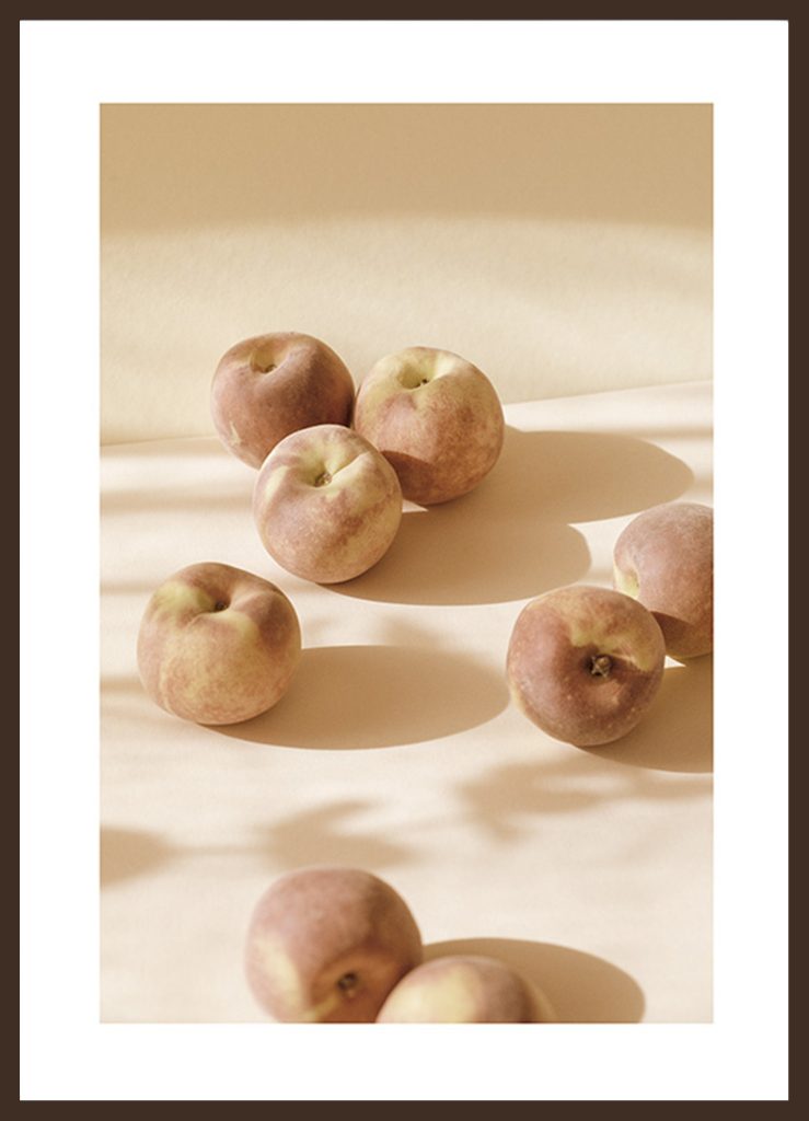 Fresh Peaches Poster
 Photograph with soft and warm colors of fresh peaches. Give your kitchen more love and color with Desenio's kitchen wall art. The poster is printed with a white margin around the image to frame the design nicely.