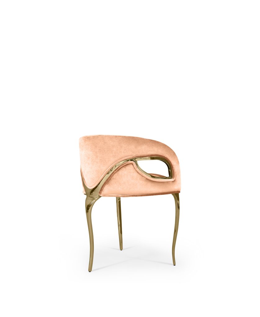 KOKET Chandra | Chair
 Chandra is both bold and daring. The modern edge in this chair exudes the feeling of vintage glam, while metal bands delicately bind the chair highlighting the sculpted fluidity of the tight back upholstery.