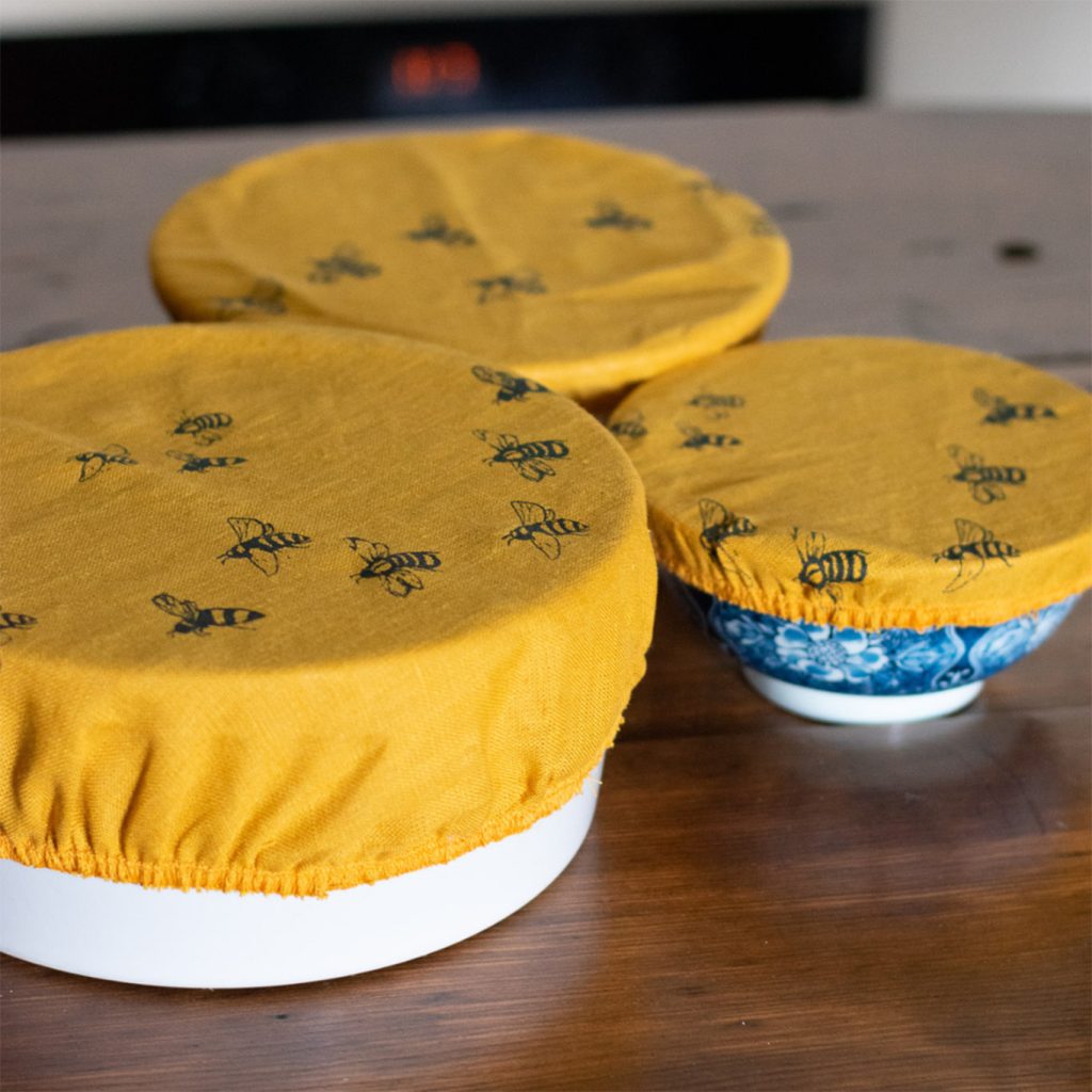 Set of Three Multi-sized Bee Mustard Linen Bowl Covers.