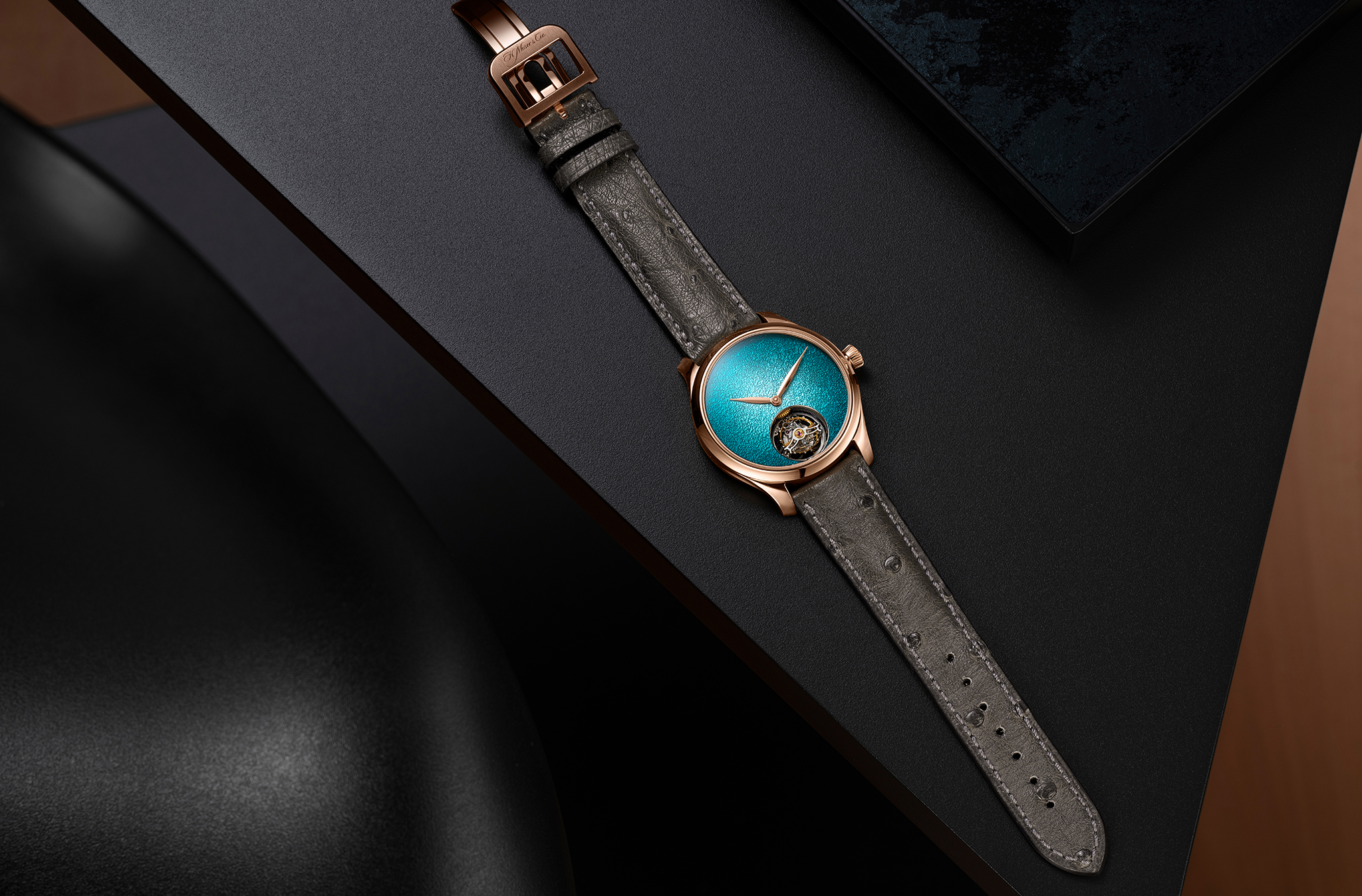 The Endeavour Tourbillon Concept Turquoise Enamel by H. Moser & Cie., reference 1805-0400, 5N red gold model, Turquoise fumé dial, grey ostrich leather strap.