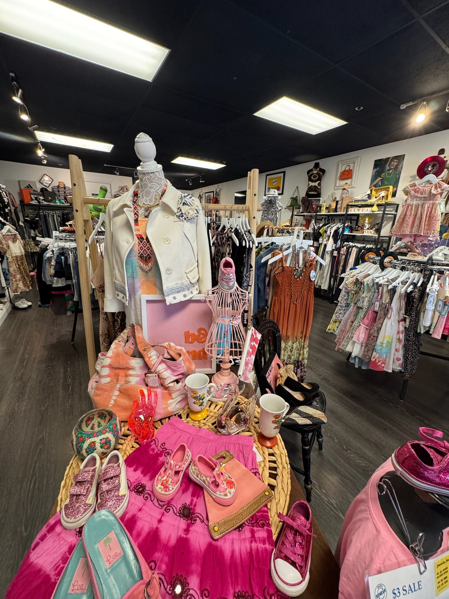 A playful, pink-forward display highlights Project ReWear's joyful approach to secondhand shopping, showcasing vibrant children's wear, accessories, and repurposed decor. Photo courtesy of Project ReWear.