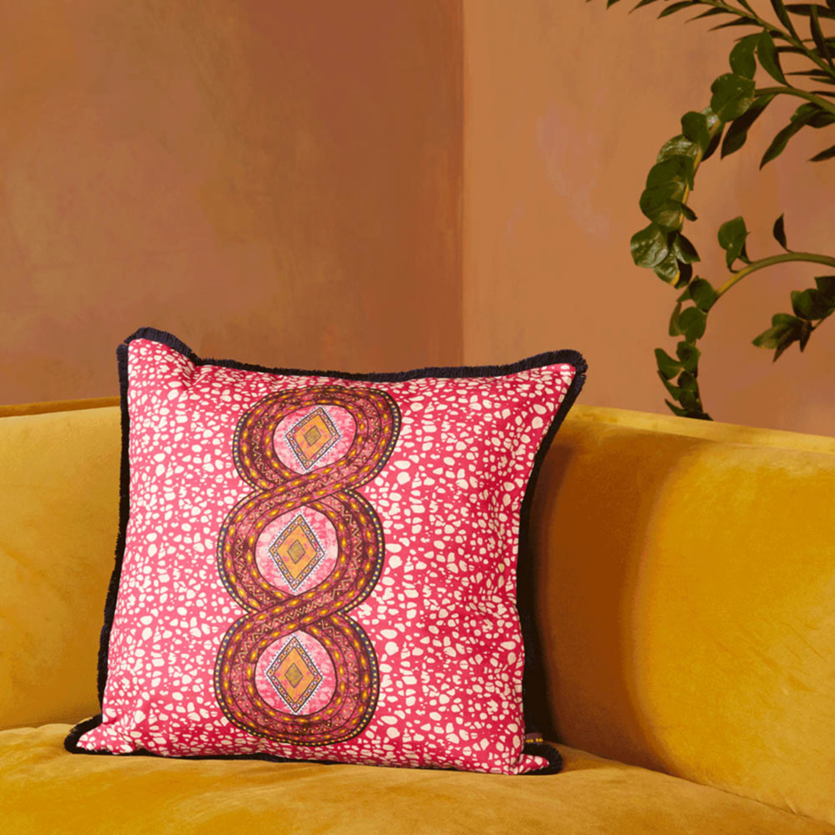 Idunu Cushion - Pink
Invite some energy into your decor with this striking and vibrant Idunu Cushion. This piece exudes a striking sense of warmth that is framed by a stunning black fringe detail. With a breathtaking display of pink, red and orange, this gorgeous cushion is sure to inject your home with a mesmerising sense of luxury and playful design.