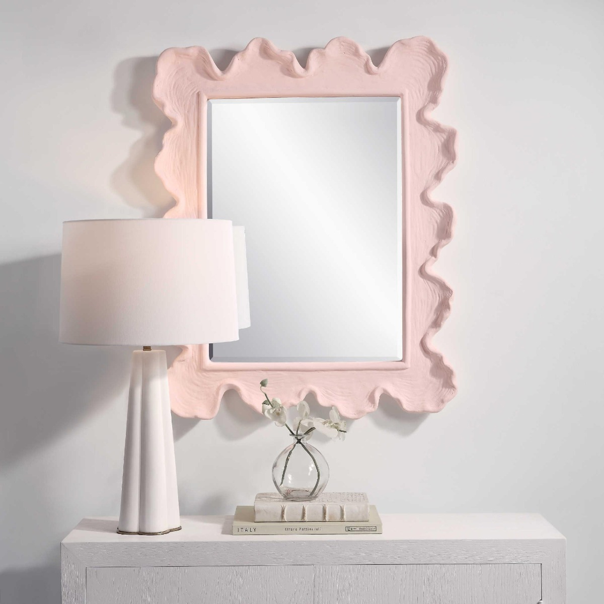 Sea Coral Pink Mirror by Uttermost
Adore peachy perfection with this utterly charming Sea Coral Pink Mirror by Uttermost. This piece features a modern coastal design with an organic frame bathed in a gentle rosewater pink, showcasing distinct waves and texture.