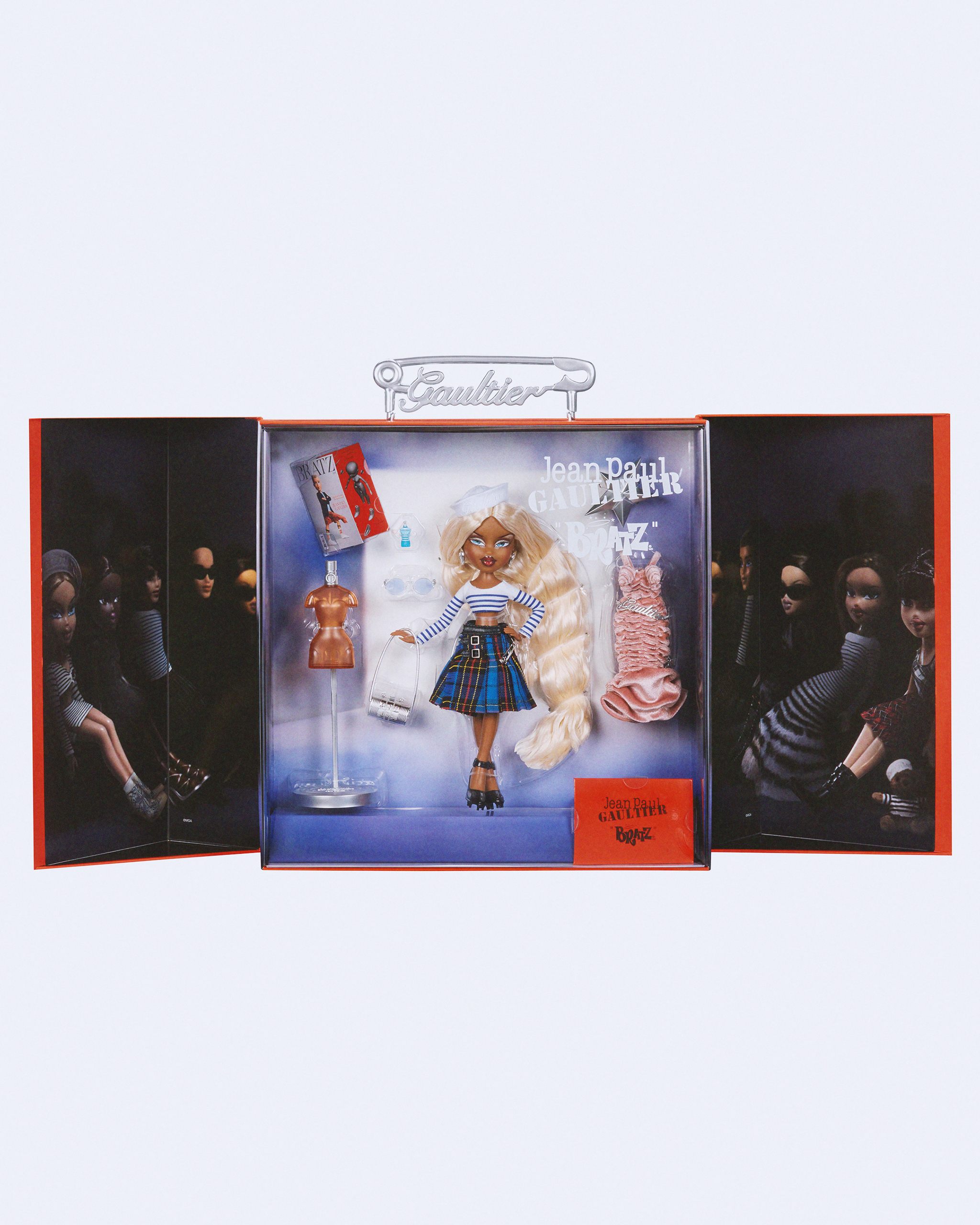 Bratz® x Jean Paul Gaultier Collector Doll - In Package Open
A standout luxury collectible, the The Bratz x Jean Paul Gaultier Collector Doll includes two outfits, fun accessories - like a mini Bratz x Gaultier fashion magazine and Gaultier fragrance bottle - along with custom packaging featuring a branded "Gaultier" safety pin handle and a surprise fold-out display.