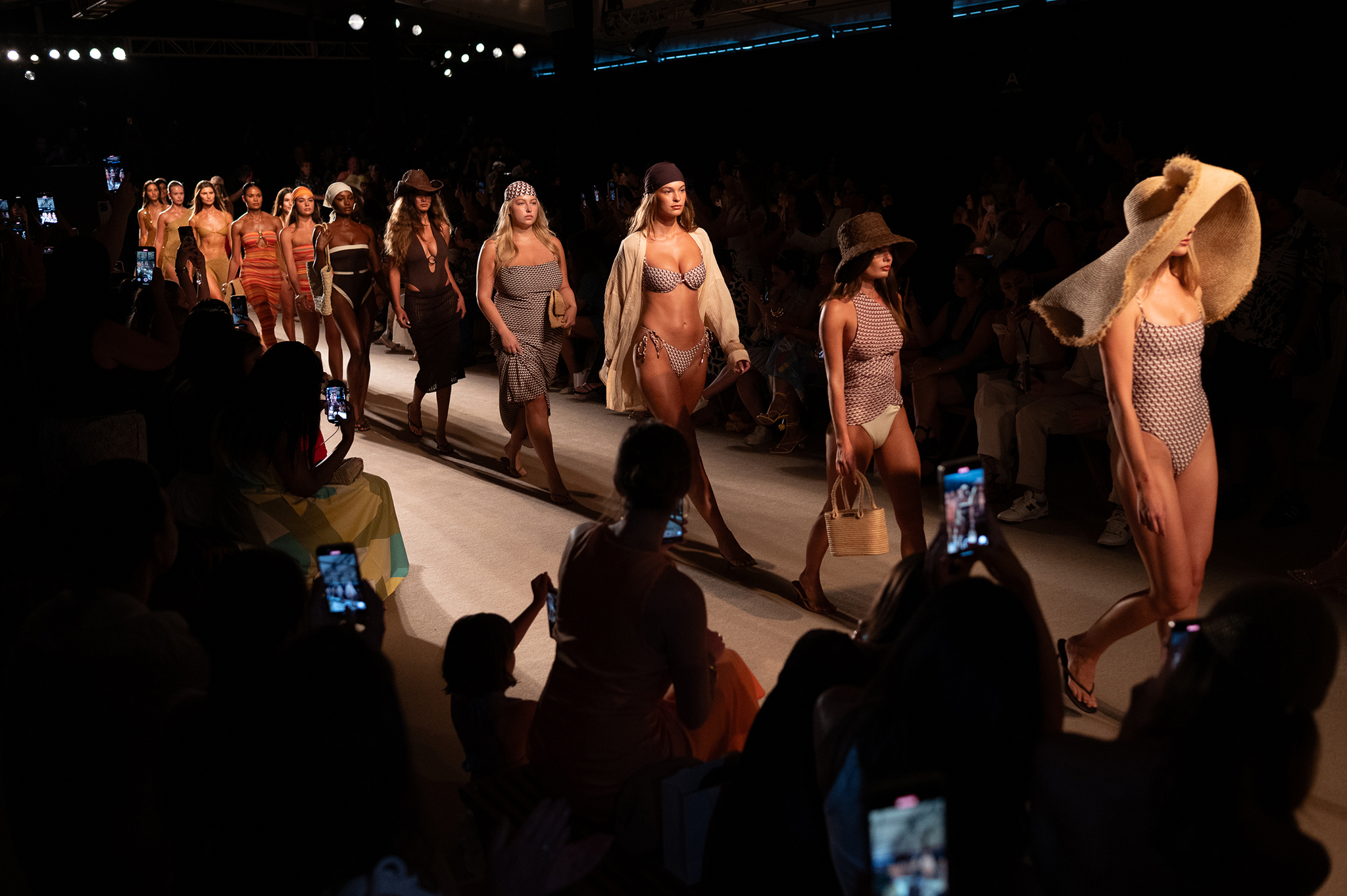 Models walk down the runway at the MONDAY SWIM Fashion Show.