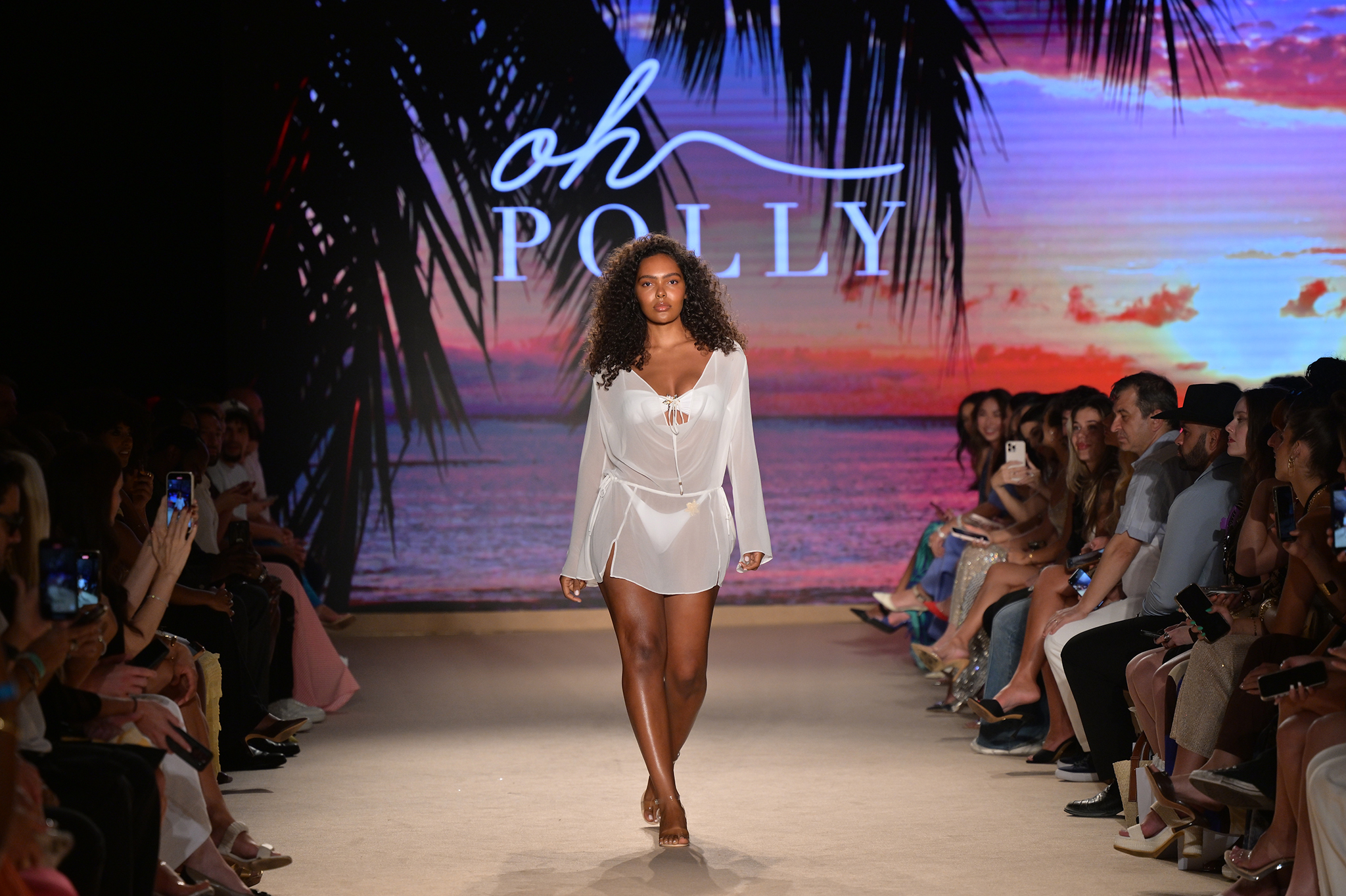 A model walks down the runway at the Oh Polly Fashion Show.