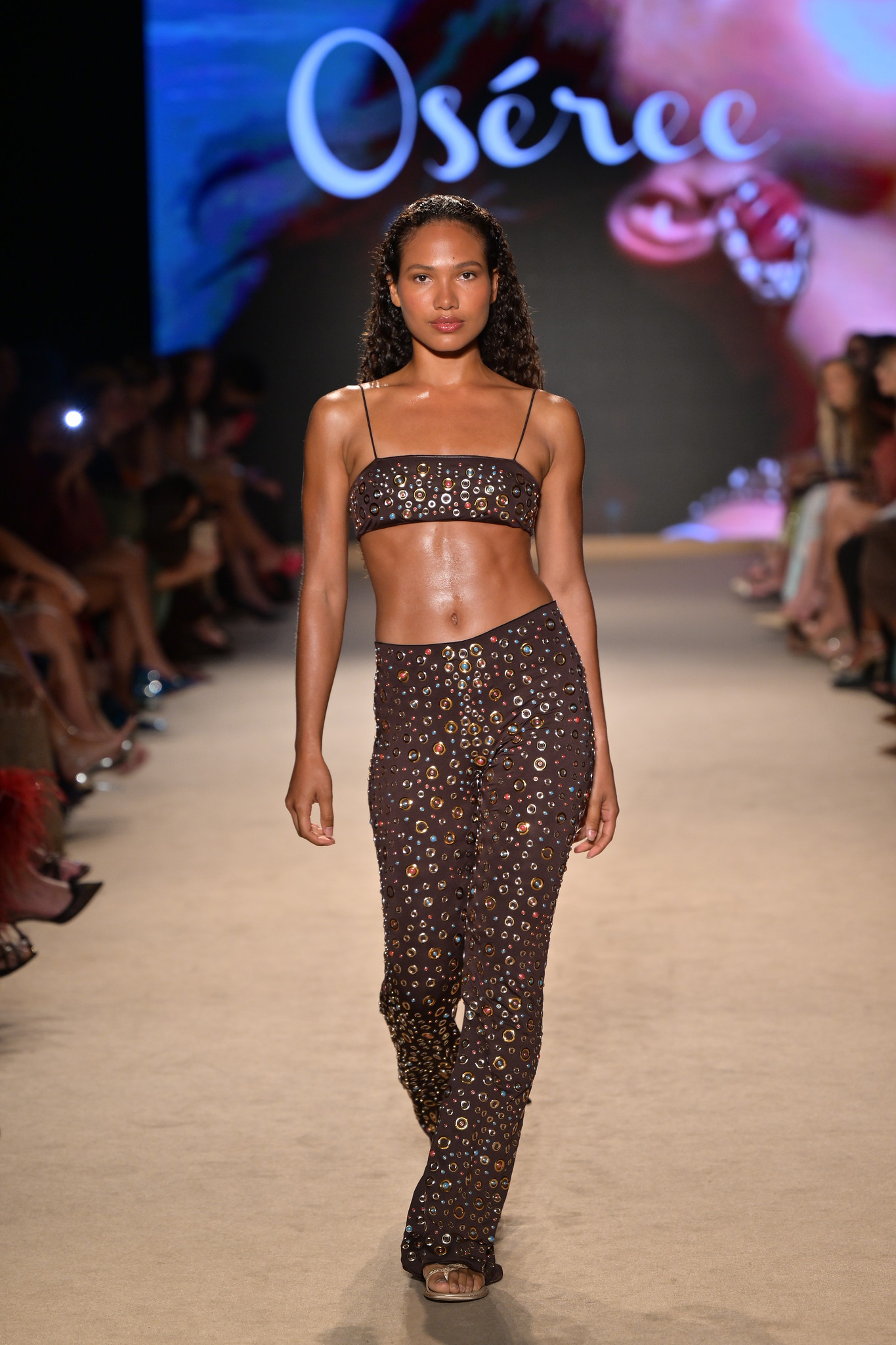 A model walks down the runway at the Oséree Fashion Show.