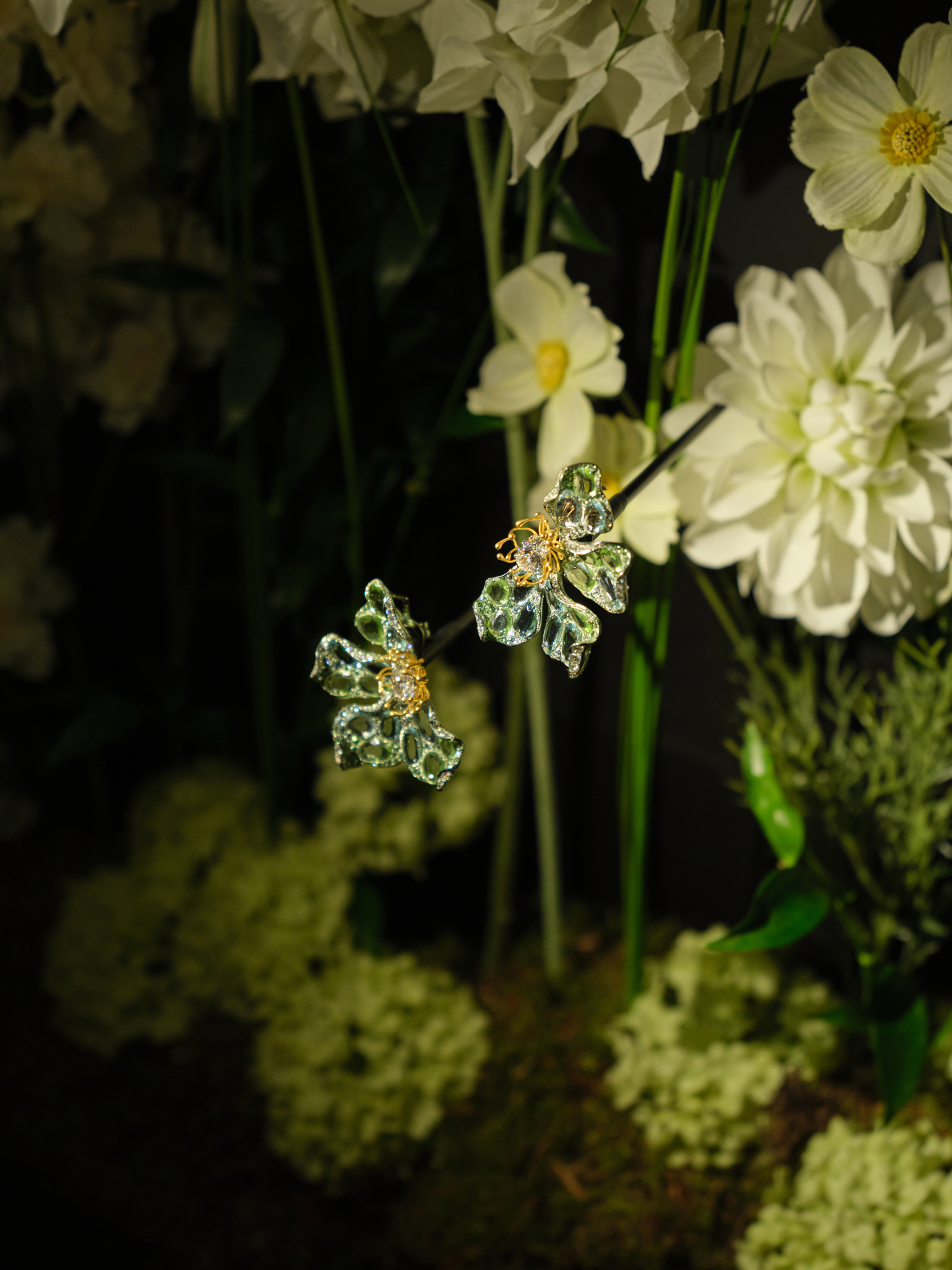 Titanium Multi-Colored Sapphire Earrings (Yellow)
Main stones: Pair of Oval-Cut Diamonds, 4.02 carats. Side stones: 29 Rose-Cut Multi-Colored Sapphires, 22.37 carats. 179 Accent Tsavorites, 3.23 carats | 109 Accent Aquamarines, 2.41 carats. Round Brilliant Cut Diamonds, 2.08 carats. Set in titanium & 18-carat gold.