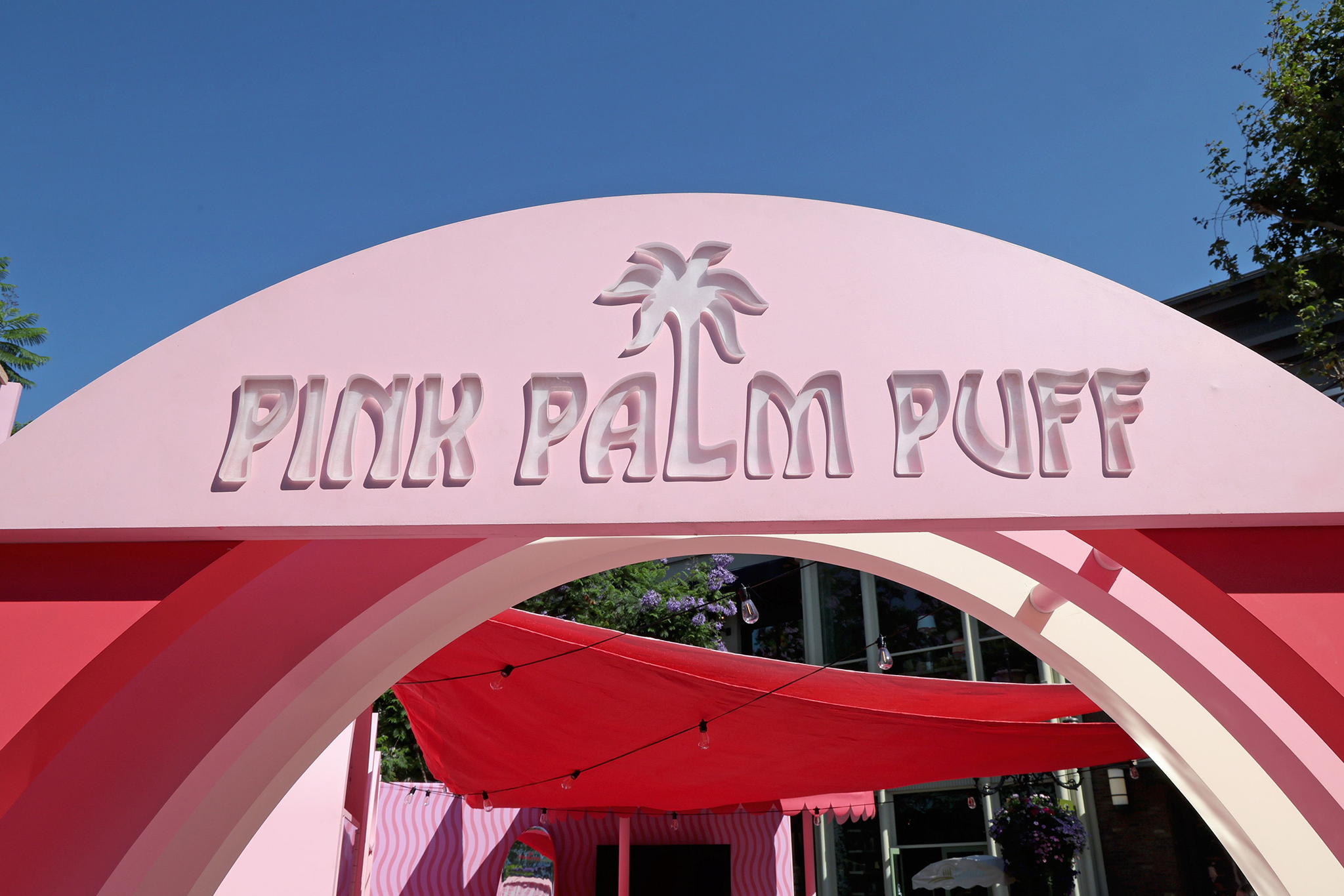 LOS ANGELES, CALIFORNIA - AUGUST 08: Pink Palm Puff VIP Pop-Up is seen during the Pink Palm Puff VIP Pop-Up Event at The Grove on August 08, 2025 in Los Angeles, California. (Photo by Phillip Faraone/Getty Images for Pink Palm Puff)