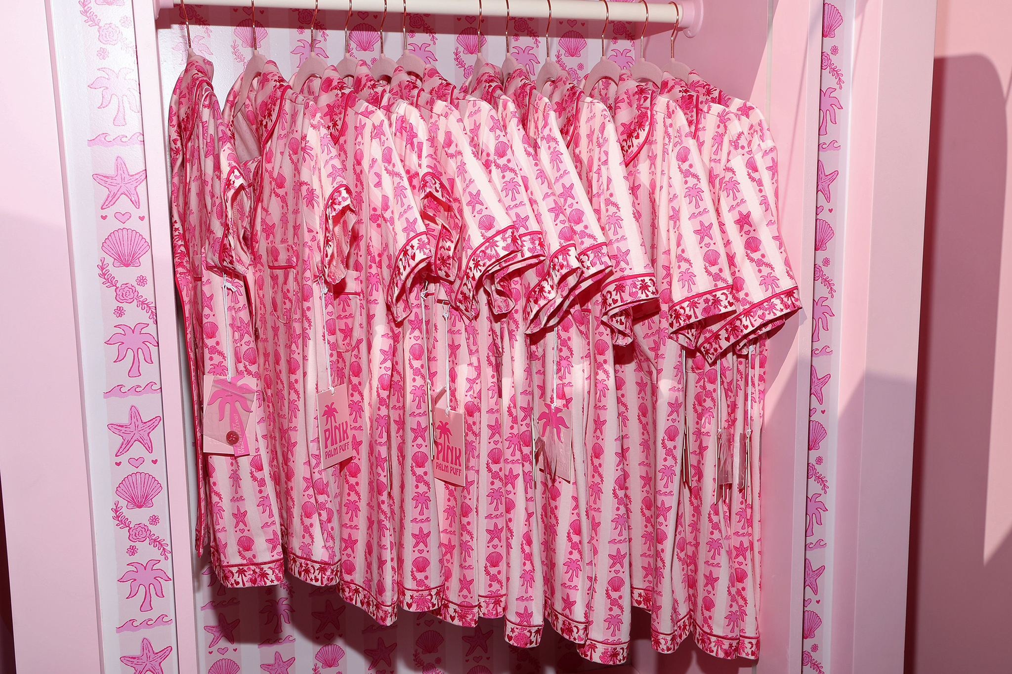 LOS ANGELES, CALIFORNIA - AUGUST 08: Pink Palm Puff clothes are seen during the Pink Palm Puff VIP Pop-Up Event at The Grove on August 08, 2025 in Los Angeles, California. (Photo by Phillip Faraone/Getty Images for Pink Palm Puff)