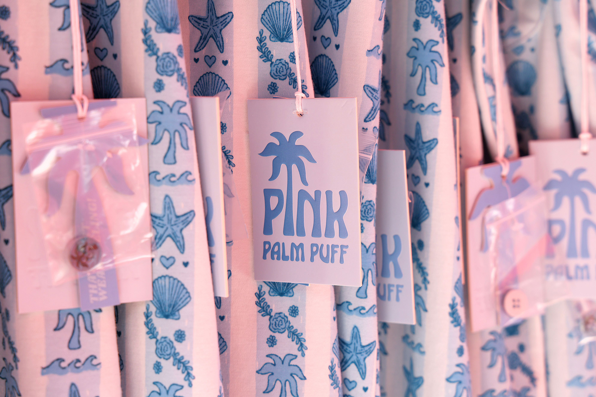 LOS ANGELES, CALIFORNIA - AUGUST 08: Pink Palm Puff clothes are seen during the Pink Palm Puff VIP Pop-Up Event at The Grove on August 08, 2025 in Los Angeles, California. (Photo by Phillip Faraone/Getty Images for Pink Palm Puff)
