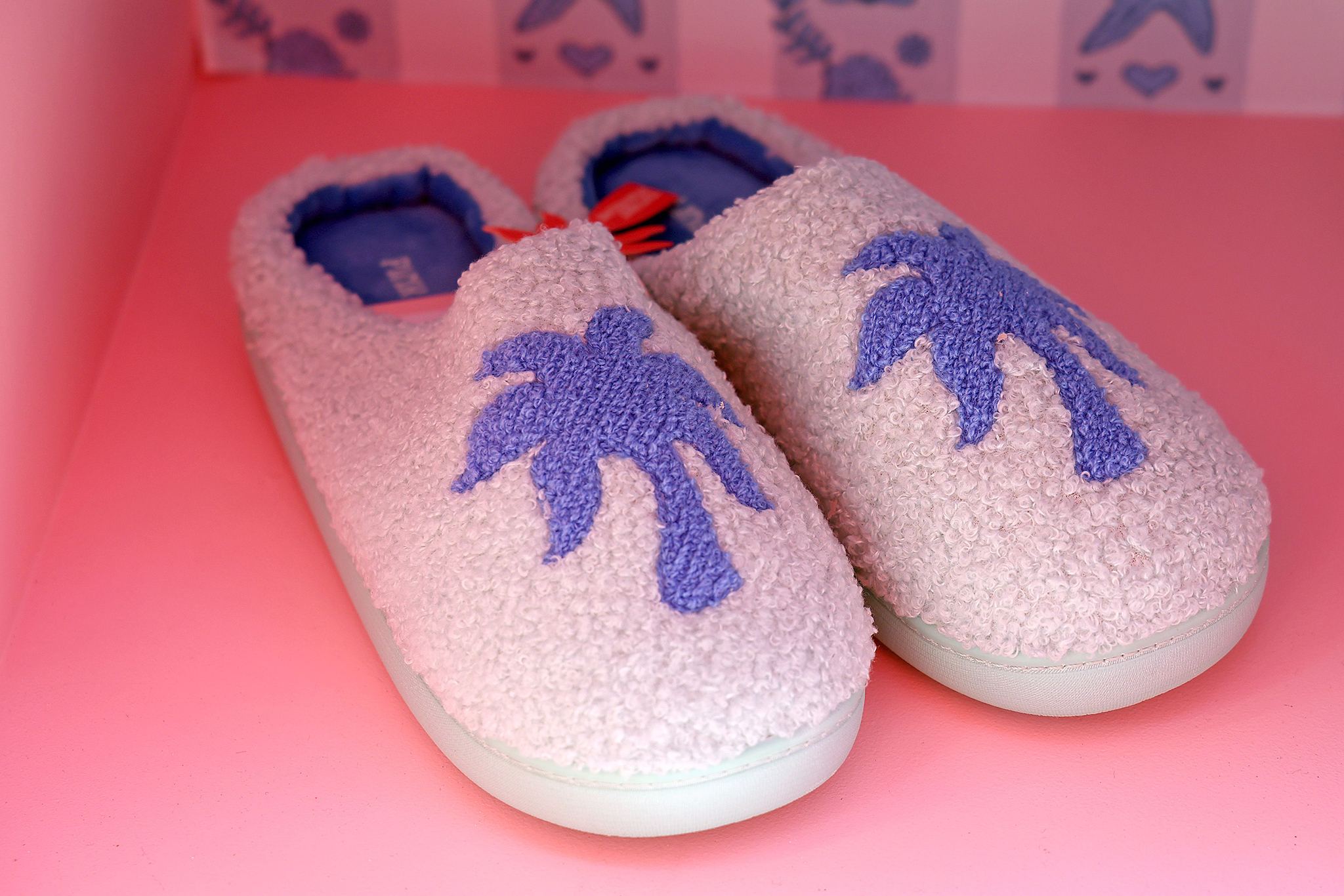 LOS ANGELES, CALIFORNIA - AUGUST 08: Pink Palm Puff slippers are seen during the Pink Palm Puff VIP Pop-Up Event at The Grove on August 08, 2025 in Los Angeles, California. (Photo by Phillip Faraone/Getty Images for Pink Palm Puff)
