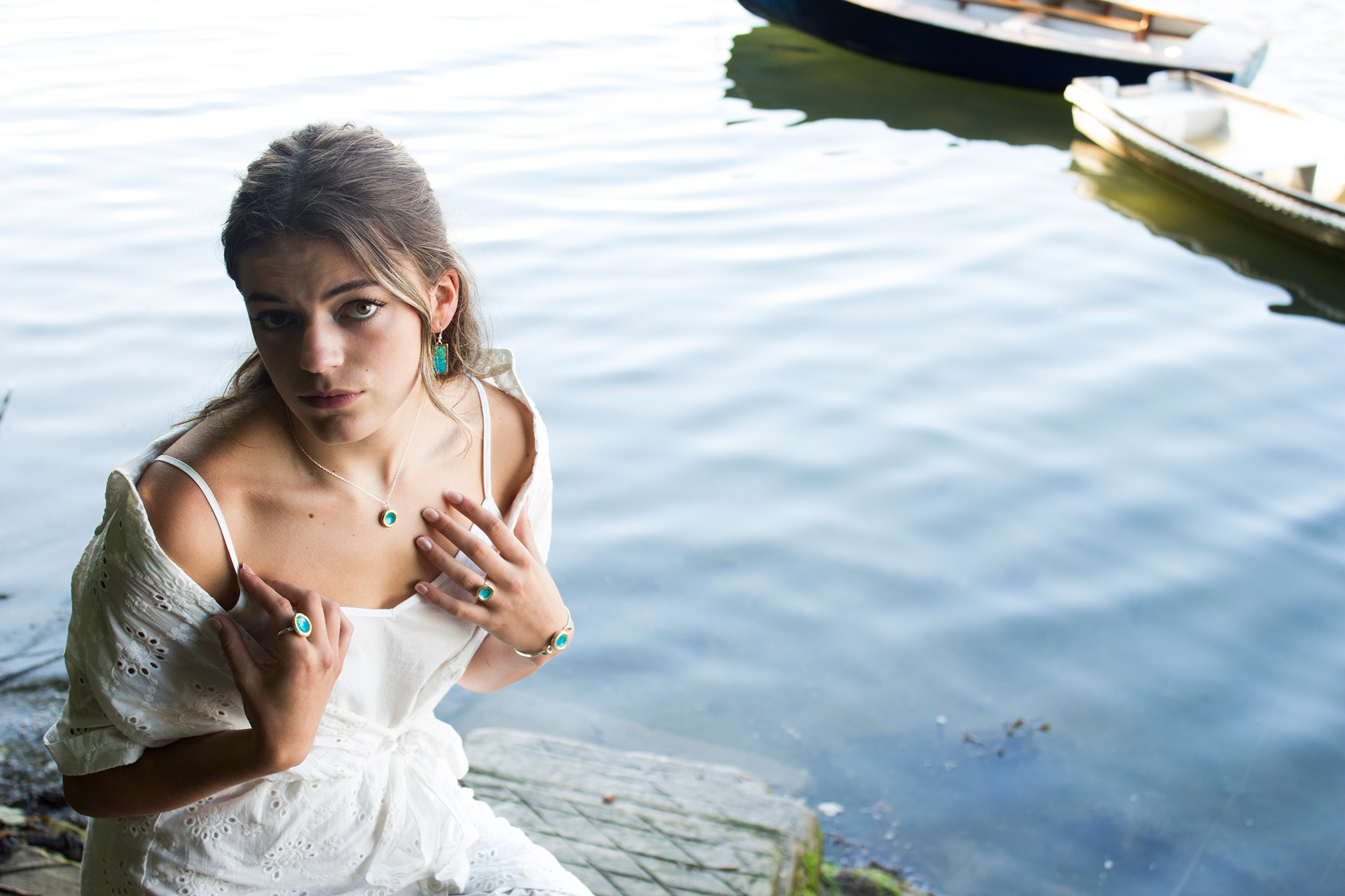 Habulous presents sterling silver jewelry handcrafted in its studio using ceramic and glass, finished with refined gold detailing. Inspired by the Devon coastline, the Emerald Turquoise Lagoon collection captures the light, adding rich green and turquoise tones to any outfit. Each piece reflects the shifting light and colors found in the natural landscape. Handmade in Habulous' Dartmoor studio, every design is entirely unique. Hand-painted real gold lustre completes these elegant and contemporary pieces. Designed as a thoughtful gift for her and a timeless addition to any jewellery collection, the sterling silver band ring is adjustable for a comfortable fit.