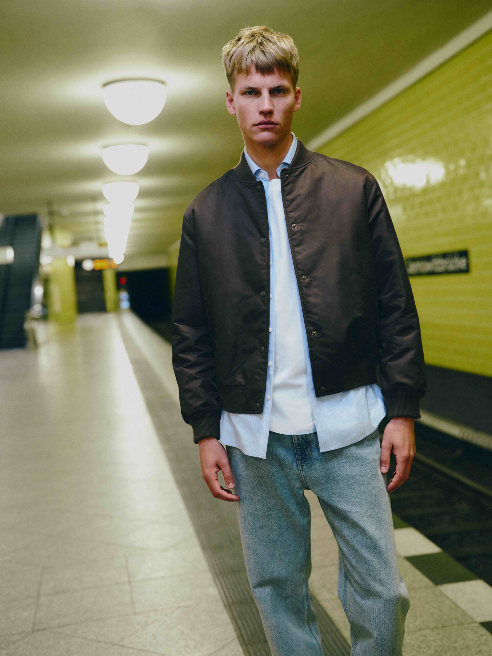 M&S - Jacket Chocolate, Chambray Shirt, Ultimate T-Shirt White, Straight Jean and Leather Slim Line Trainer. Photo: Marks and Spencer.