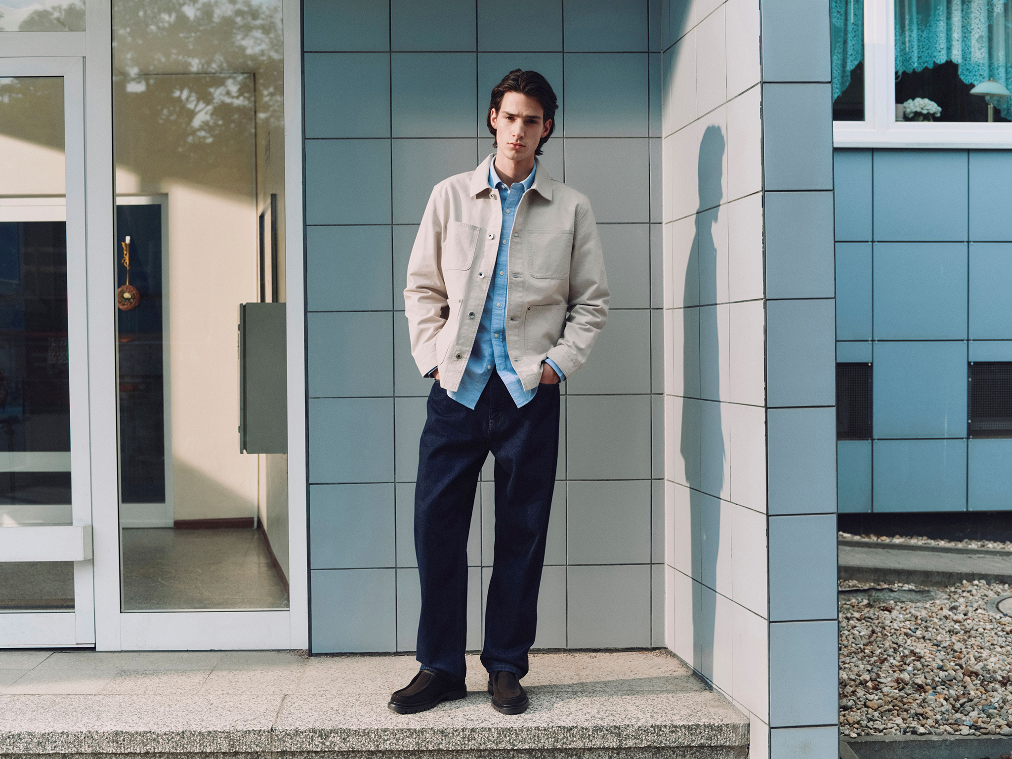 M&S - Light Cotton Jacket Nuetral, Oxford Shirt, Dark Indigo Rigid Jean and Shoes. Photo: Marks and Spencer.