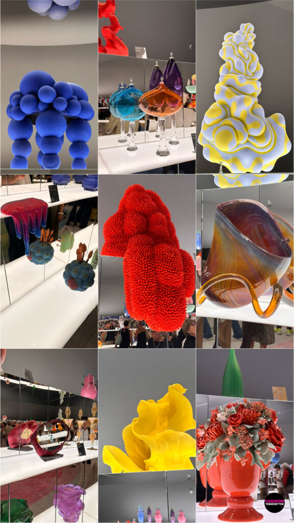 Homo Faber 2026: An Island of Light - A Rainbow of Forms A Rainbow of Forms, supported by JSW Foundation, celebrated the expressive power of color through an exuberant collection of objects crafted from plastic, enamel, resin, glass, and a wide range of other materials. Arranged on mirrored shelves and rotating bases beneath an expansive mirrored ceiling, the pieces created an immersive environment in which color, light, and reflection continually transformed the perception of form. The interplay of surfaces and perspectives lent the exhibition space a sense of movement and visual abundance, revealing the versatility of contemporary craftsmanship across diverse materials. Anchoring the installation was an exquisite rug designed by Es Devlin and inspired by Goethe's Theory of Colours, bringing an artistic and conceptual dimension to this vibrant exploration of colour, perception, and design. Photos © 2026, Senay Gokcen for Fashion Trendsetter.